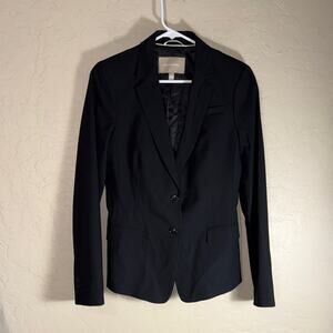 Banana republic women’s black wool blend blazer with a bit of stretch. Size 8.